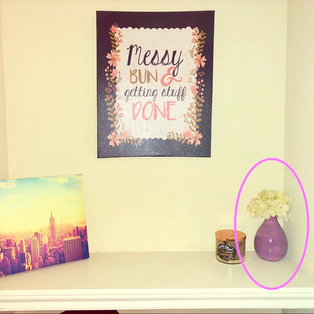 Glass purple vase with white fake flowers
